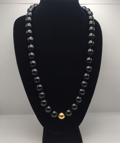 Vintage Costume jewelry Large Size Black Beads w/ Single Gold Tone Bead Continuous Necklace- Statement Necklace- Chunky Bead Necklace K#3027 - Large Black Beaded Necklace - 1 Gold tone bead - Hand Knotted between beads - Length: 28 inches - Width: 1/2 inch - No Clasp, continuous necklace - Good and clean condition Necklace K, Chunky Bead Necklace, Chunky Bead Necklaces, Necklace Chunky, Black Bead Necklace, Chunky Beads, Necklace Statement, Vintage Costume Jewelry, Vintage Costumes