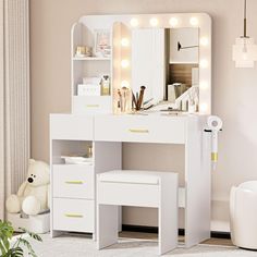 a white vanity with lights on it and a teddy bear