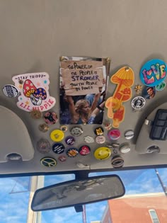 there are many buttons and magnets on the back of a car