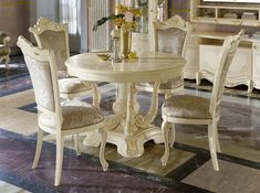 a white table and chairs in a room