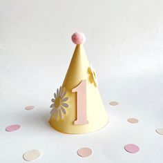 a party hat with the number one on it