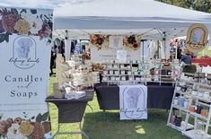 a tent with candles and soaps on display