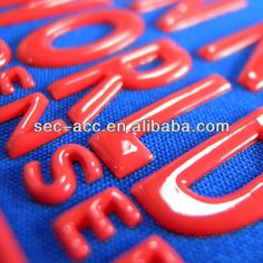 red plastic letters on blue fabric