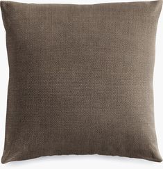 a brown pillow on a white background