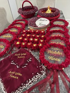 a table topped with lots of red and gold items