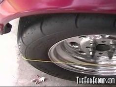 the front tire of a red car is shown