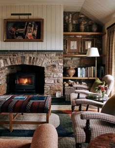 a living room filled with furniture and a fire place