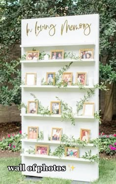 a white book shelf with photos and greenery on it that says, wedding memory