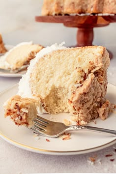 a piece of cake on a plate with a fork next to it and another slice missing