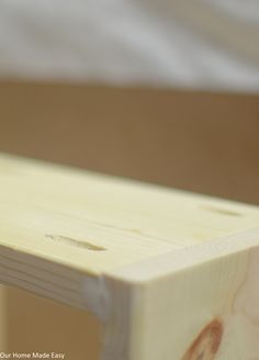 a close up view of a piece of wood that is being used as a bench