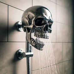 a skull shower head is spouting water from the faucet