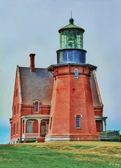 a large red brick building with a light tower