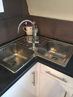 the kitchen sink is clean and ready for us to use