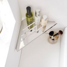 a bathroom shelf with various items on it