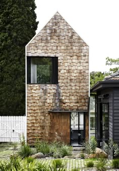 a house made out of wood and shingles