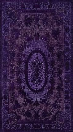 a purple rug with an intricate design on it