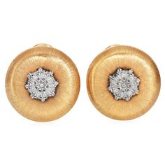 This Vintage collectible  Buccellati earring is made in 18k yellow and white gold. With famous Buccellati's signature Rigato finish. It is a testament to the brand's dedication to naturalistic beauty. Earrings Measure 22mm wide.  Signed Buccellati, Italy, 18k. Total Weight: 15.8 grams Condition: Excellent In Excellent Condition Luxury Yellow Gold Clip-on Diamond Earrings, Exquisite Yellow Gold Clip-on Earrings, Luxury White Gold Round Clip-on Earrings, Luxury Screw Back Earrings For Formal Occasions, Luxury Round Clip-on Diamond Earrings, Luxury Clip-on Yellow Gold Earrings, Yellow Gold Round Diamond Clip-on Earrings, Luxury Yellow Gold Screw Back Earrings, Luxury Yellow Gold Earrings With Screw Back