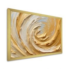 an abstract painting with gold and white colors on a white wall above it is a wooden frame