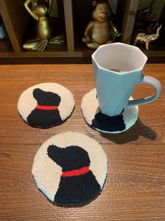 three coasters that have been made to look like hats