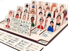 a group of cards with pictures of people and names on them, sitting next to each other