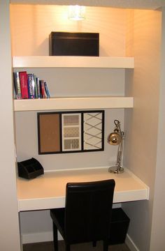 there is a shelf with some books on it and a lamp next to the bookcase