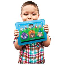 a little boy holding up a tablet with animals on it