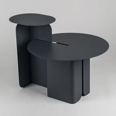 two black tables sitting next to each other