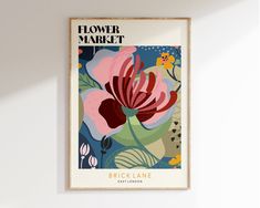 a flower market poster hanging on the wall