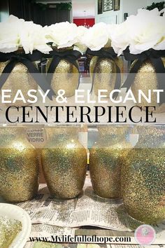 gold glitter vases with black ribbon and white flowers in the background text reads easy & elegant centerpiece