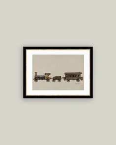 three old fashioned train cars sitting side by side in a black frame on the wall