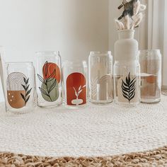 a table topped with lots of glasses on top of a rug