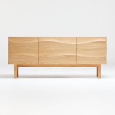 the sideboard is made out of wood and has two drawers