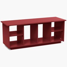 a red shelf with three shelves on one side and two open spaces on the other