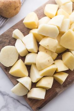 sliced potatoes on a cutting board next to a potato