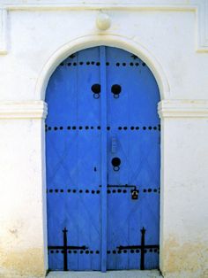 the blue door is open to let in some light