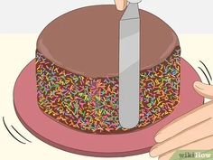 someone is cutting into a chocolate cake with sprinkles