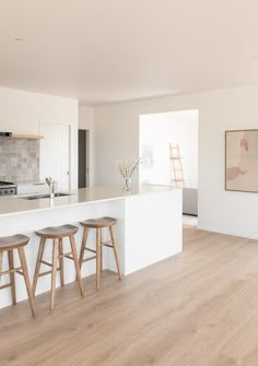 the kitchen is clean and ready to be used as a living room or dining area