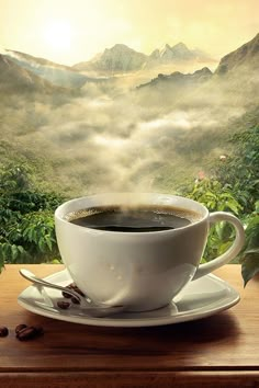 a cup of coffee sitting on top of a saucer next to a window covered in fog