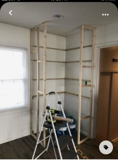 a ladder is in the corner of a room