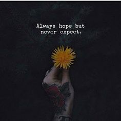 a person holding a yellow flower in their hand with the words always hope but never expect