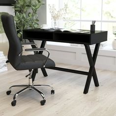 an office chair sits in front of a desk