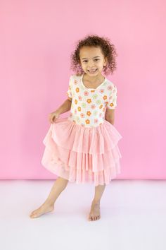 Twirl into spring and summer fun with our Feelin' Flowerful Dream Tutu Dress Crafted from soft, bamboo material, this short sleeve dress is perfect for frolicking and twirling around. Let your little one's unique personality bloom in this fun and playful dress! Made from theÂ softest and most breathable seasonal bamboo viscose material,Â your babe won't want to take this off! Designed for extra play and all the sass with our ruffle detail to celebrate in style!Â Girls Dress Outfits, Bamboo Material, Bodysuit Dress, Wedding Dress Shoes, Birthday Party Dress, Dress Crafts, Bubble Romper, Joggers Womens, Girls Pajamas