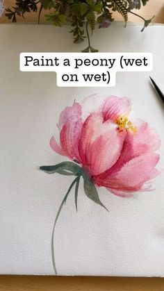 a pink flower is sitting on top of a piece of paper that says paint a peony wet on wet