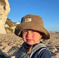 The perfect corduroy bucket sun hat for babies and toddlers! Made from 100% cotton tan corduroy makes this hat very comfortable to wear.  I made this hat with a day of adventure in mind, somewhere sunny and wild! This hat is made from a tan 100% cotton corduroy fabric.  Inside liner is white cotton.  All baby and child sizes come with chin straps. Brim measures approx. 2.5" wide. Crown measures approx. 3.5" deep. See link below for adult sizes. SIZES AVAILABLE 0-3 mos. - fits 14" to 16" head cir Baby Bucket Hat, Toddler Bucket Hat, Beach Vacation Ideas, Baby Summer Hat, Old Bucket, Corduroy Bucket Hat, Toddler Beach, Floppy Beach Hat, Gender Neutral Baby Gifts