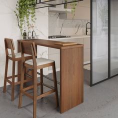 a kitchen with an island and bar stools next to the counter top, in front of a glass door