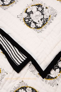 detail of a cotton hand stitched quilt, showing the black edging and black and white hand block printed reverse side and front pattern in our Camellia design. Block Print Quilt, Wedding Present, Printed Quilt, Soft Natural, Cotton Blankets, Sofa Throw, Cotton Voile