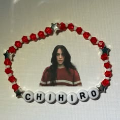 a red and white beaded bracelet with the word chihro on it