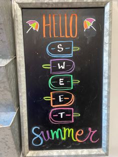 a chalk board with the words hello summer written on it