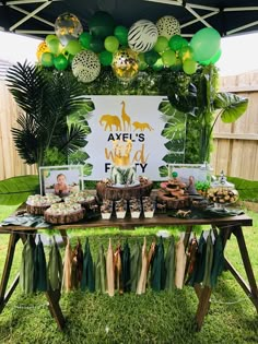 a table topped with lots of food and desserts