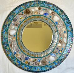 there is a mirror with shells on it